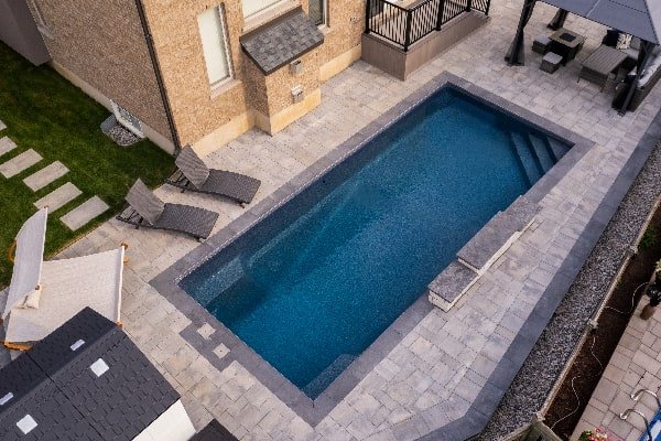 Pool Design and Construction Overhead Photo of Pool and Relaxing Chairs