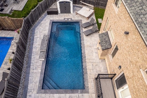 Pool Design and Construction Overhead Photo of Pool and Interlock Patio