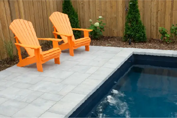 Ancaster new subdivision backyard transformation with in-ground pool and interlocking patio by Boulder Design Pools & Landscapes