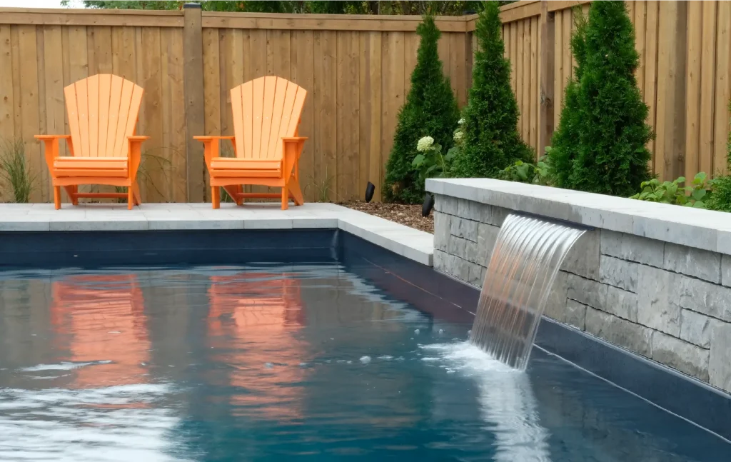 Ancaster new subdivision backyard transformation with in-ground pool and interlocking patio by Boulder Design Pools & Landscapes
