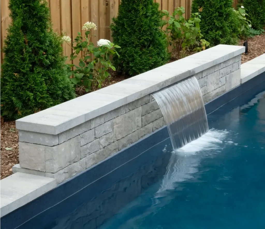 Ancaster new subdivision backyard transformation with in-ground pool and interlocking patio by Boulder Design Pools & Landscapes