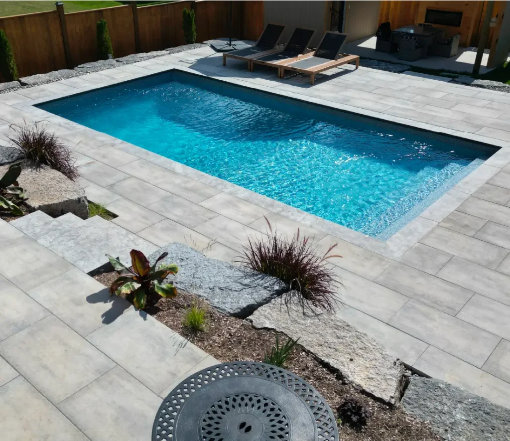 Caledonia backyard pool build and design by Boulder Design Pools and Landscapes.